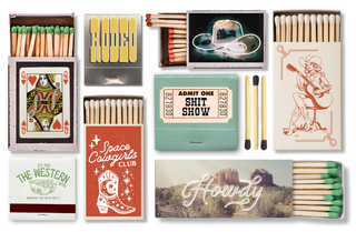 Collection of matchboxes with various designs and text.