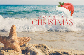 Coastal Christmas scene with starfish, Santa hat, and text overlay on a beach.