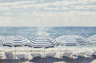 Beach scene with blue and white striped umbrellas and chairs on a sandy shore.