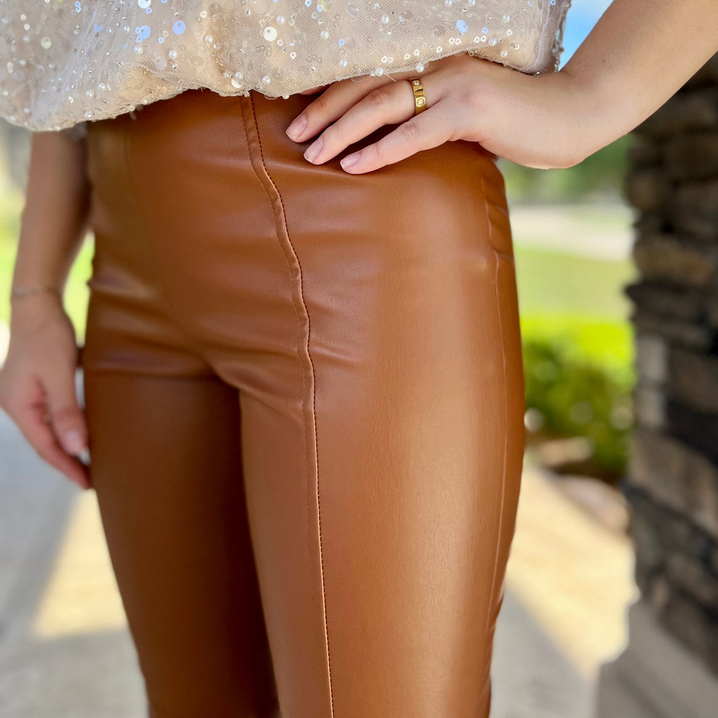 Chestnut Faux Leather Pull on Pants with a front seam and slit. 
