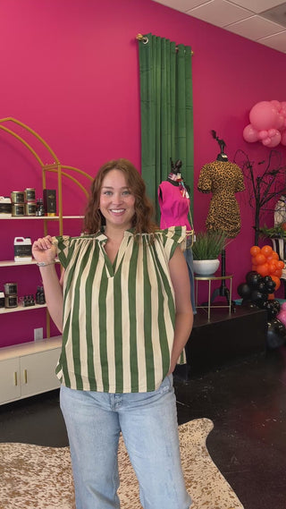Video of lady wearing the Olive Green & Ivory Striped Fluttter Sleeve Top