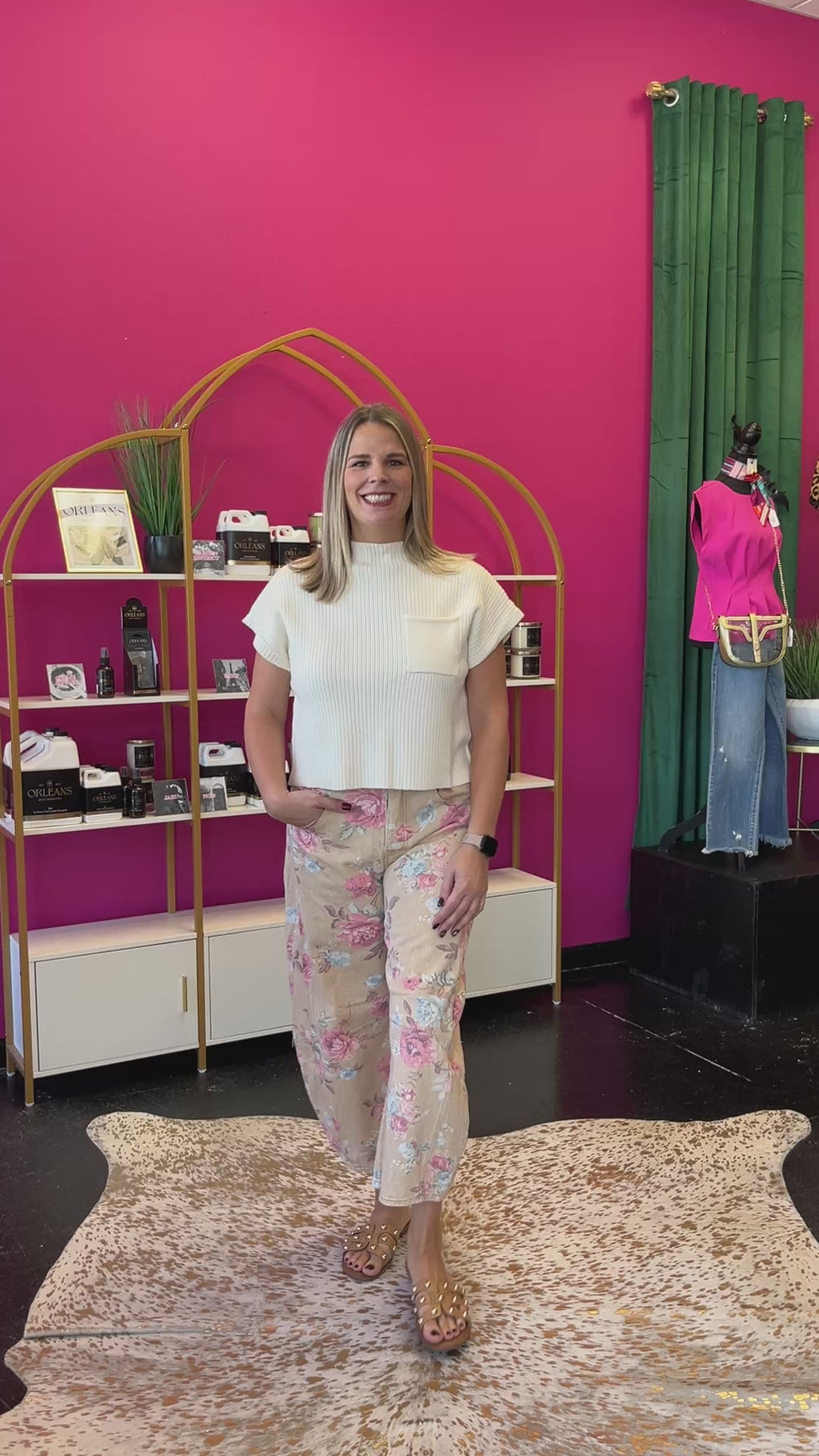 Video of lady wearing the Rose Garden Floral Denim Barrel Jeans paired with a cream shortsleeve sweater
